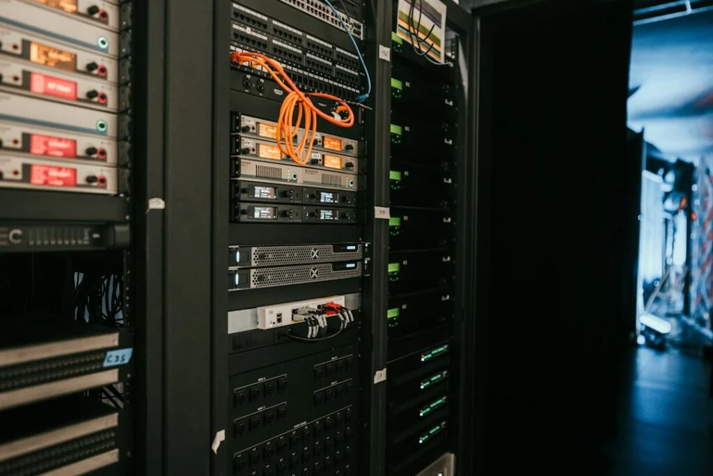 Rack of servers in a data centre, representing IT services